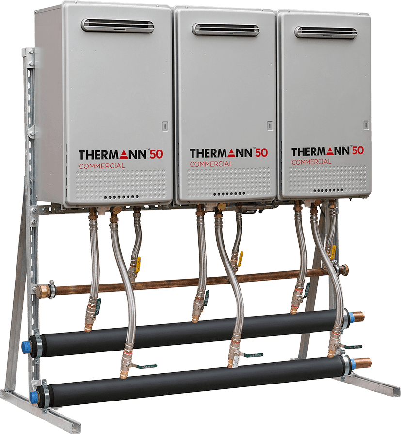 Three Thermann 50 commercial continuous-flow water heaters on a manifold frame